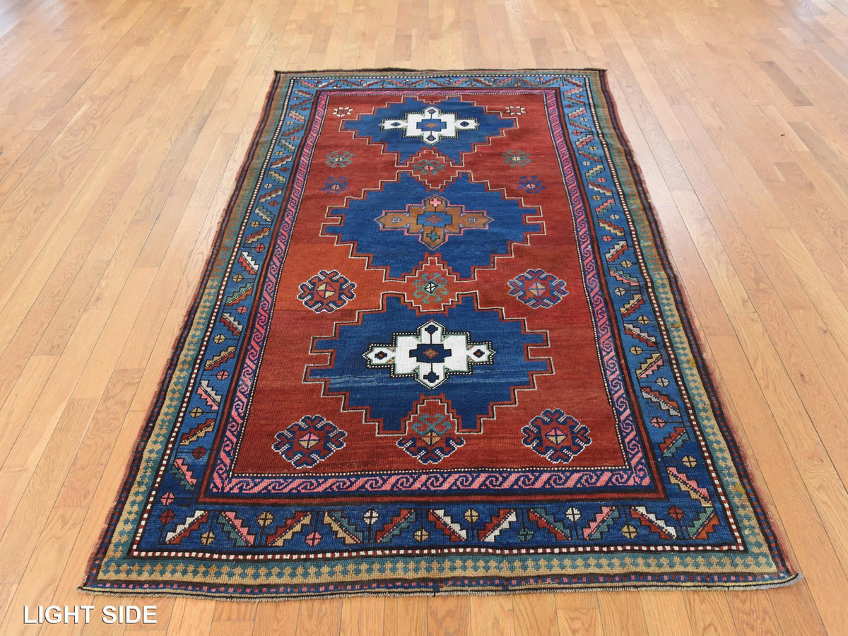 Kazak Antique hand-knotted wool rug in Red & Blue, 4'9" x 8'3" — SKU O078779 (view 3)