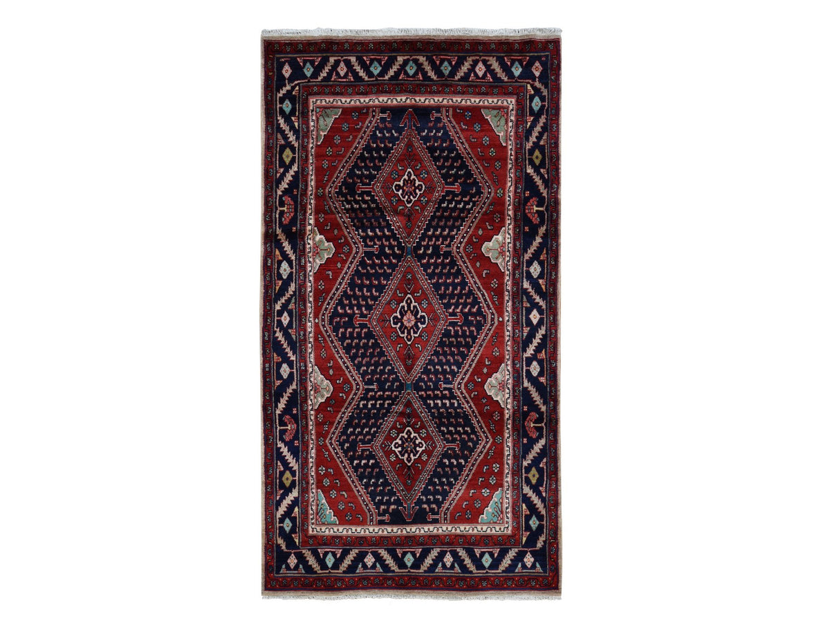 Persian hand-knotted wool rug in Red & Blue, 5'1" x 9'7" — SKU O087575