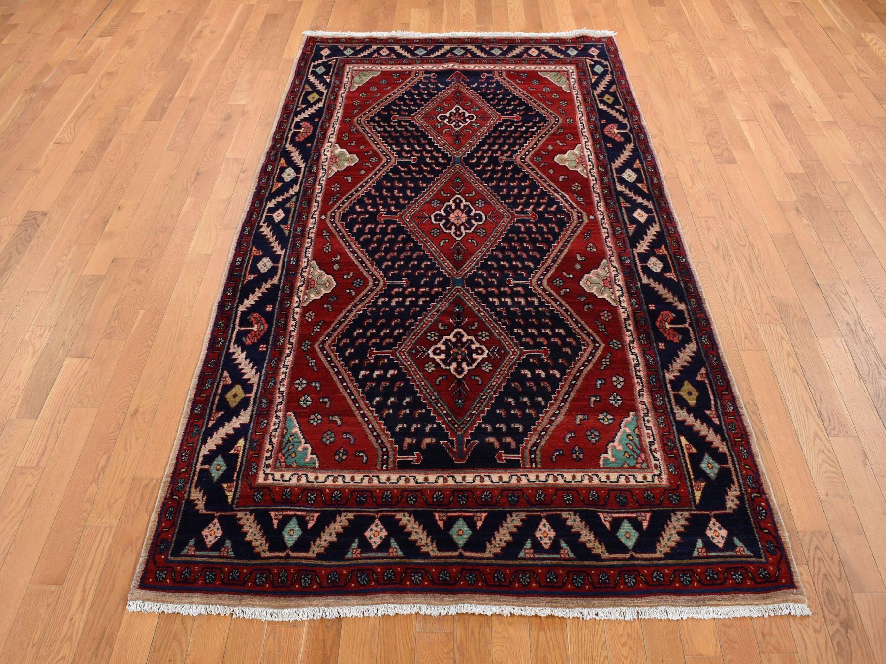 Persian hand-knotted wool rug in Red & Blue, 5'1" x 9'7" — SKU O087575 (view 2)