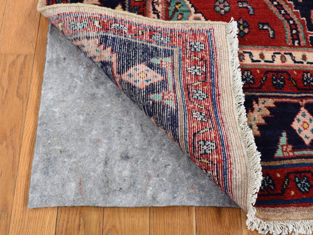 Persian hand-knotted wool rug in Red & Blue, 5'1" x 9'7" — SKU O087575 (view 4)