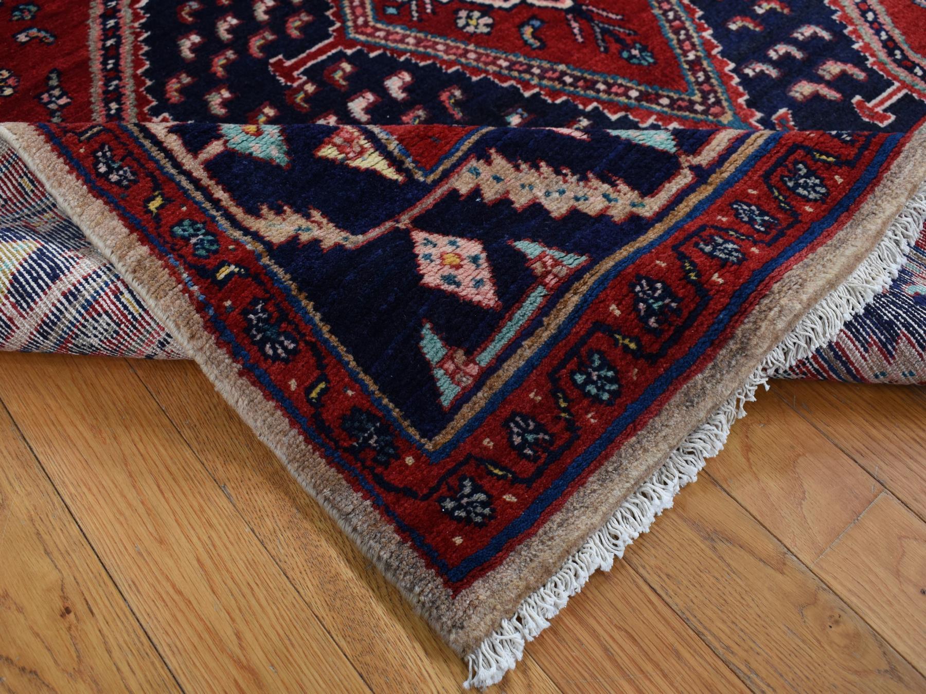 Persian hand-knotted wool rug in Red & Blue, 5'1" x 9'7" — SKU O087575 (view 5)